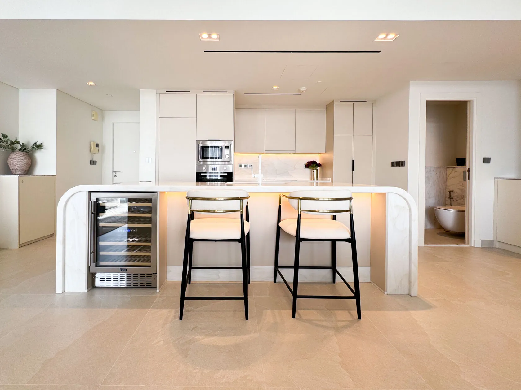 Transitional Minimalist 2-Bed Apartment – kitchen with black bar stools