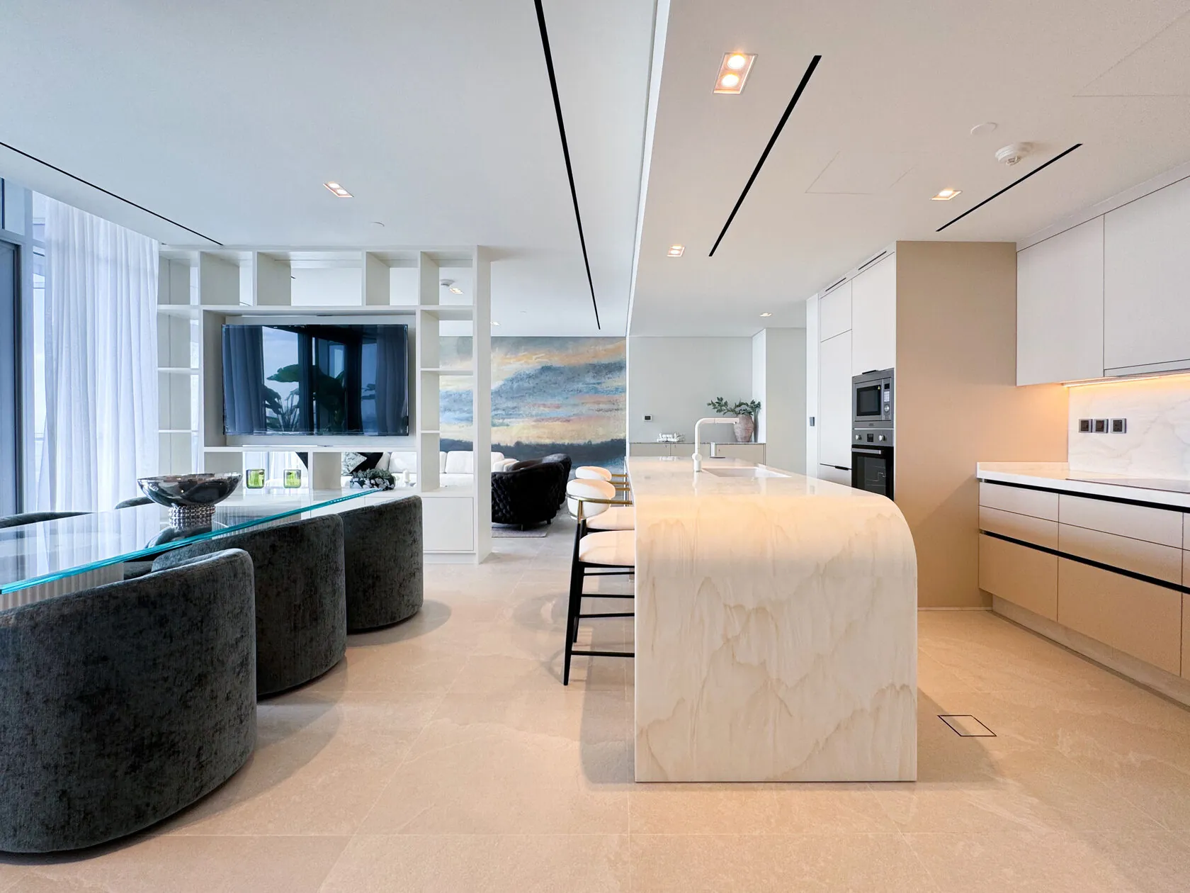 Transitional Minimalist 2-Bed Apartment – living area with stone kitchen island