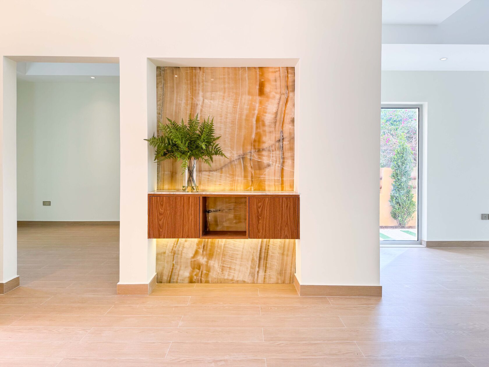 5-Bed Arabian-Style Villa – entrance hall with onyx feature wall and timber console