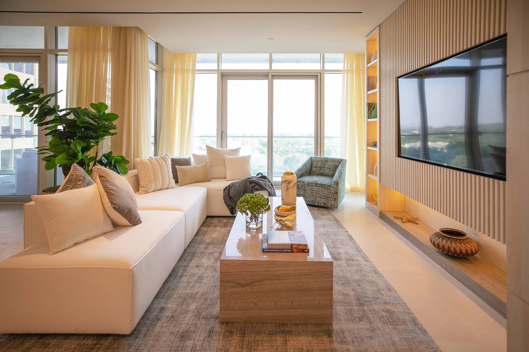 Contemporary 3-Bed Apartment – living room with slatted TV wall and built-in shelving