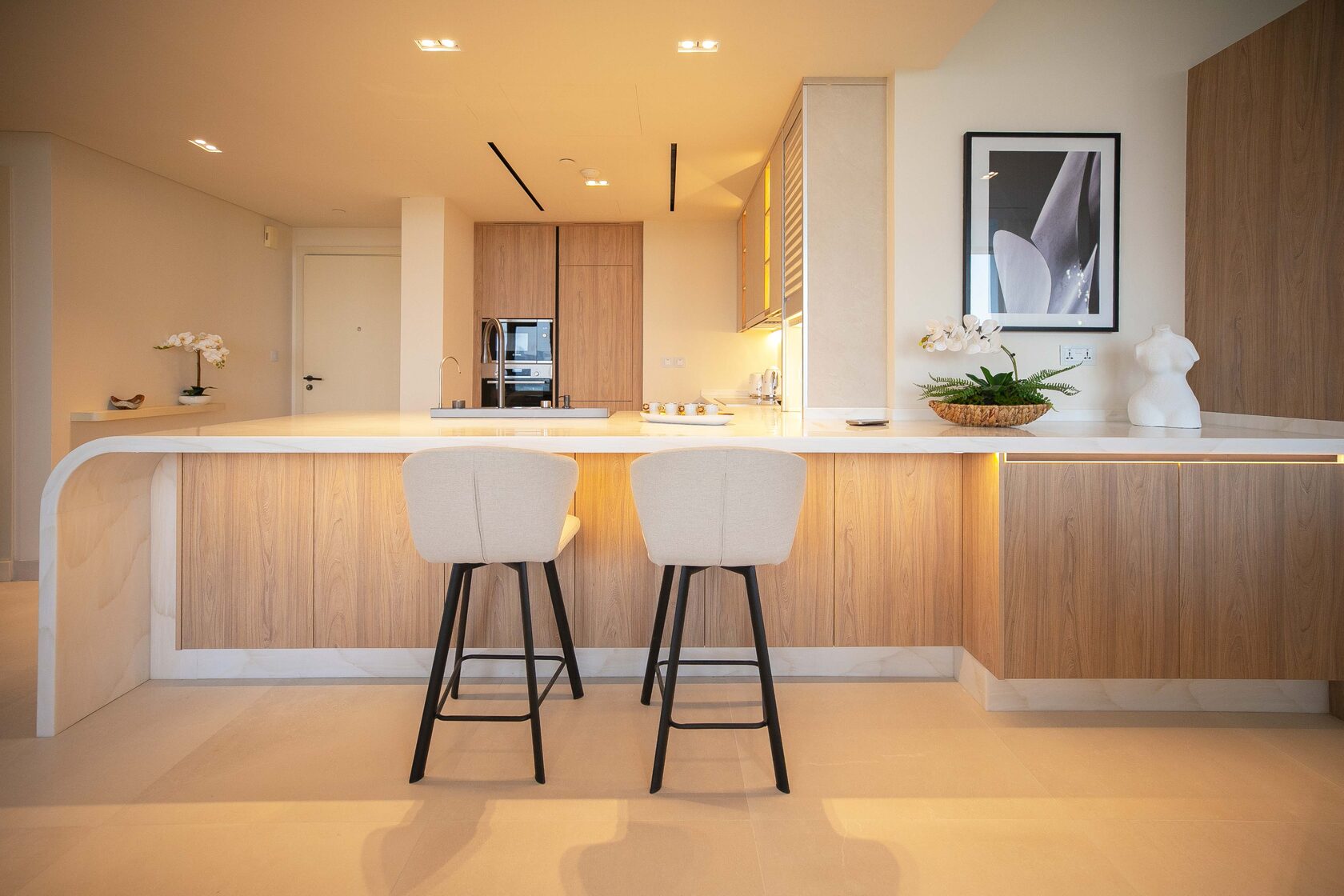 Contemporary 3-Bed Apartment – kitchen island with white bar stools