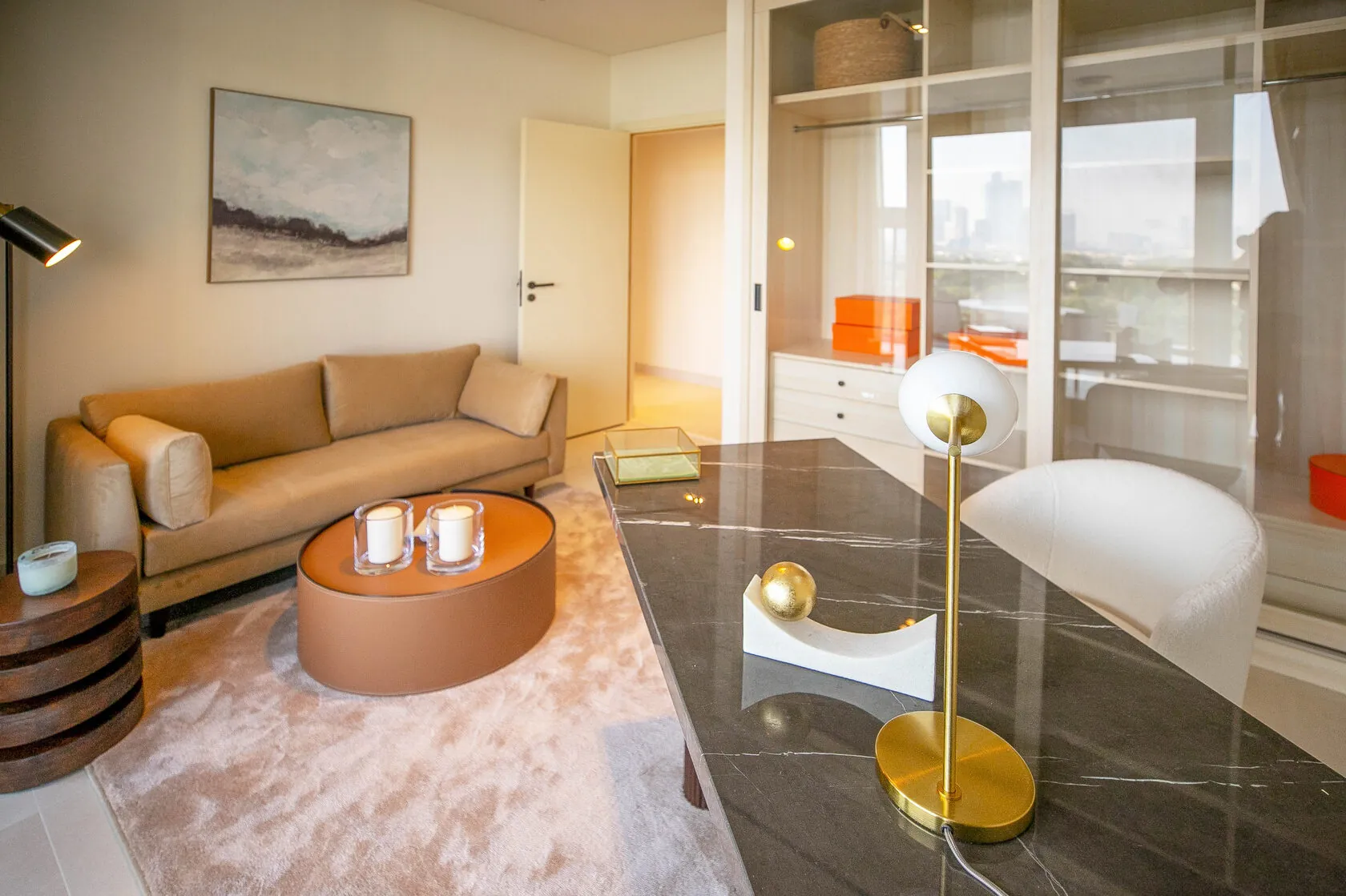 Contemporary 3-Bed Apartment – lounge with tan sofa and marble desk