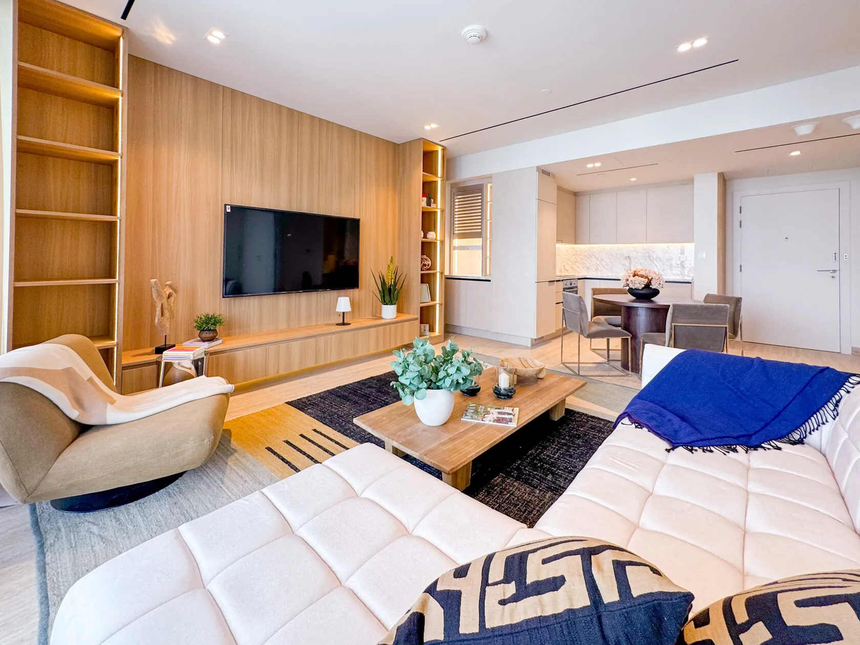 Scandi-Style 1-Bed Apartment – living room with built-in shelving and white sofa