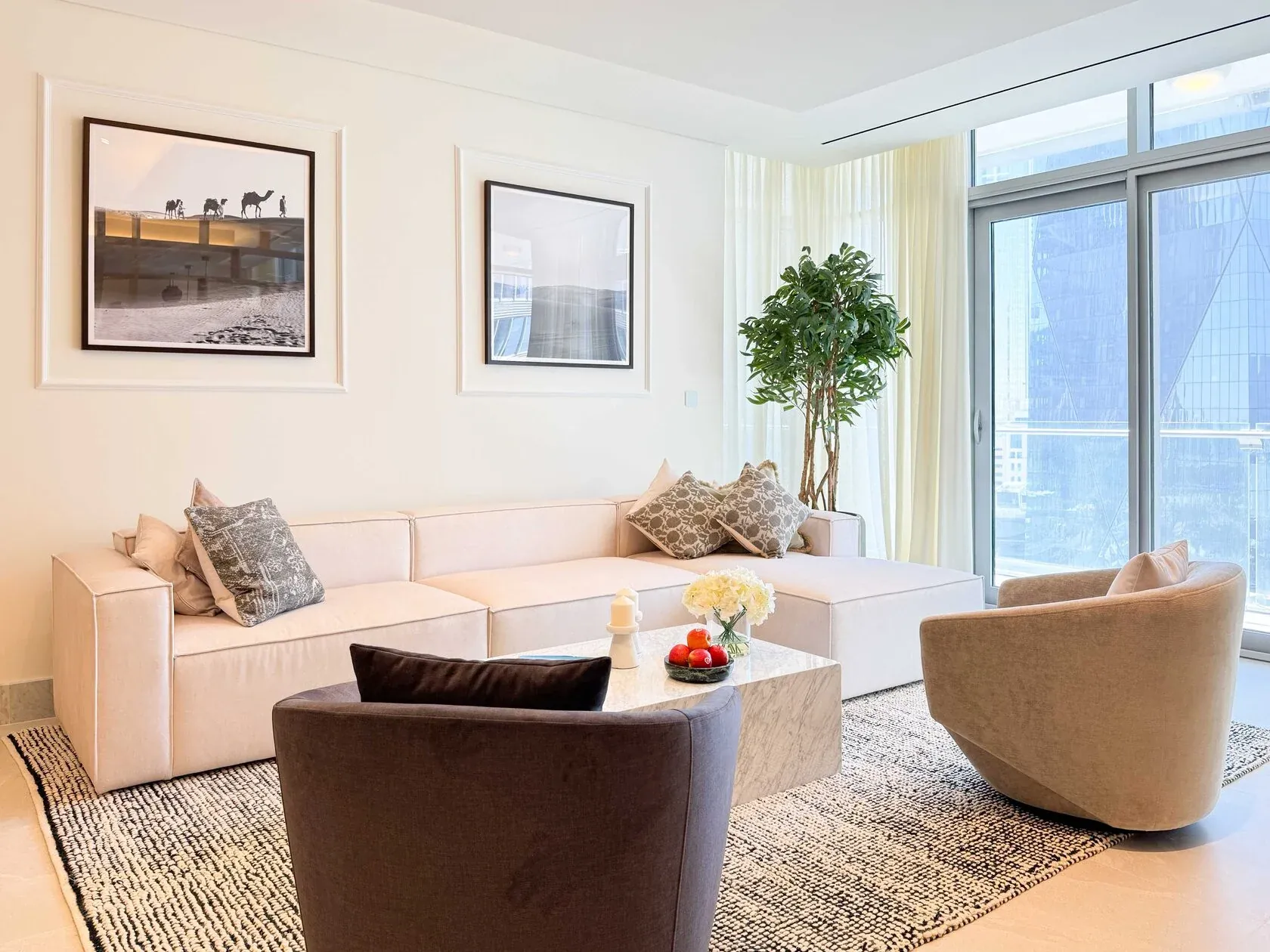 Neo-Modern 2-Bed Apartment – living room with cream sofa and brown armchair
